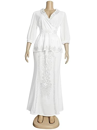 Elegant white dress on a mannequin featuring intricate embroidery