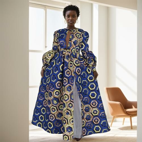 Woman in a colorful patterned dress standing indoors.