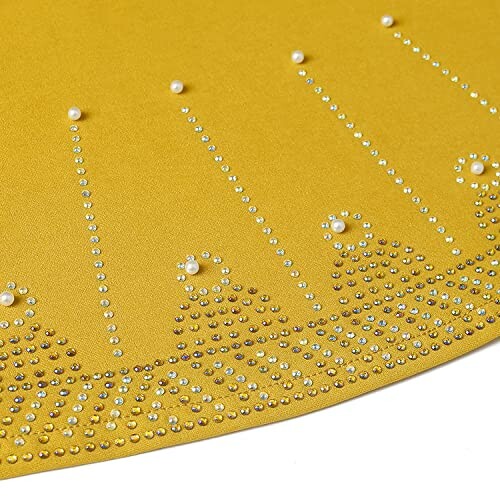 Yellow fabric with decorative rhinestones and pearls